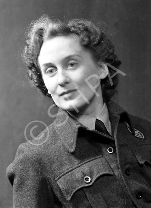 Miss MacDonald, 27 Telford Gardens. She is wearing the badge of the Royal Observer Corps. 