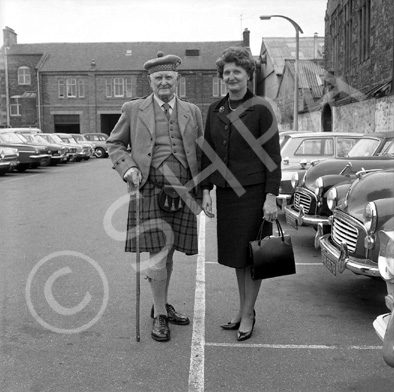 Caption states 'Betty with grandpa Matheson.' In the car park of what is now Farraline Park Bus Station, Inverness.