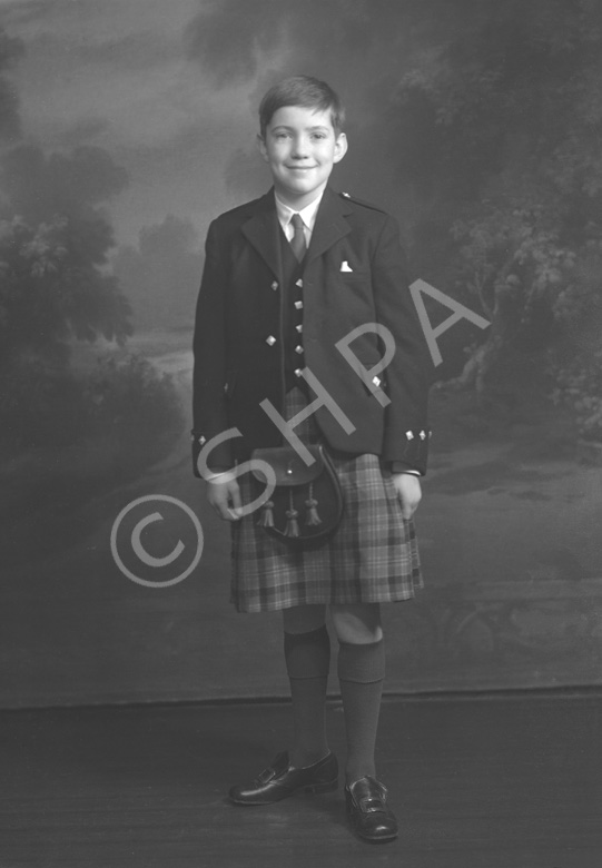 Andrew Chalmers dressed in school uniform for Sundays at the Loretto Boarding School, Edinburgh. (see also refs: 33898, 39550 and 45474). He was a grandson of the famous photographer Andrew Paterson (1877-1948).