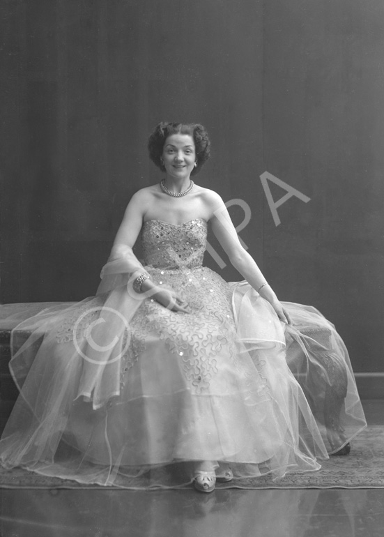 Miss Cairns, Station Hotel, Inverness, in ball gown, seated. Other images also under code 42904.