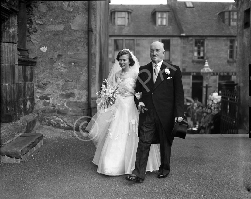 Miller, 'Broomfield,' February 1954. Bride Pat Fraser and father entering the Old High Church on Church Street, Inverness. In the background is the entrance to Deacon's Court. 