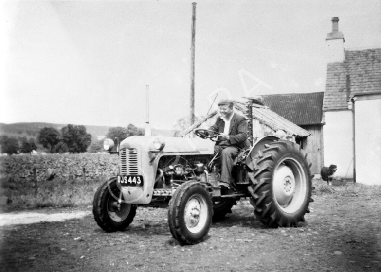 Man on a tractor. #