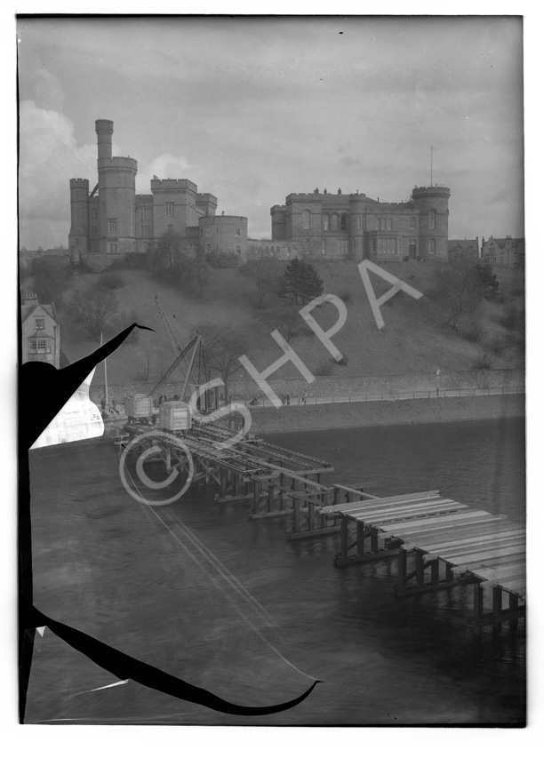 Building temporary bridge over the River Ness in 1939. (Damaged plate).*