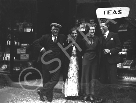 Group outside a tea shop.* 