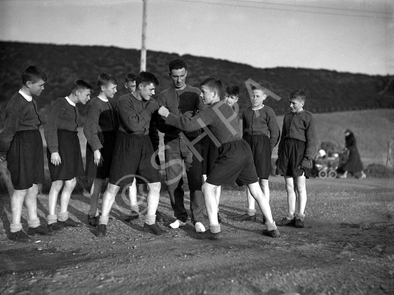 Youths sparring in boxing match. #