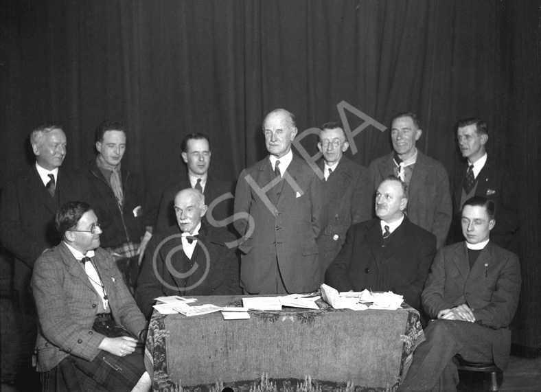 Meeting ceremony. Man seated at left appears in image H-0079. #