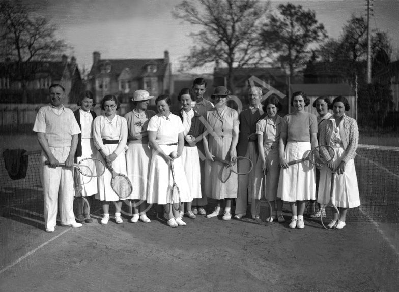 Mixed group on tennis court. #