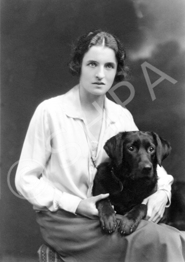 Mary Millicent (May) Fraser, daughter of Alexander and Isabella Fraser of Westwood, Inverness, with her labrador retriever Paddy, May 1925. (AP/H-0261) Fraser-Watts Collection.